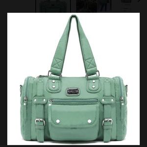New with tags mint colored Scarleton purse.